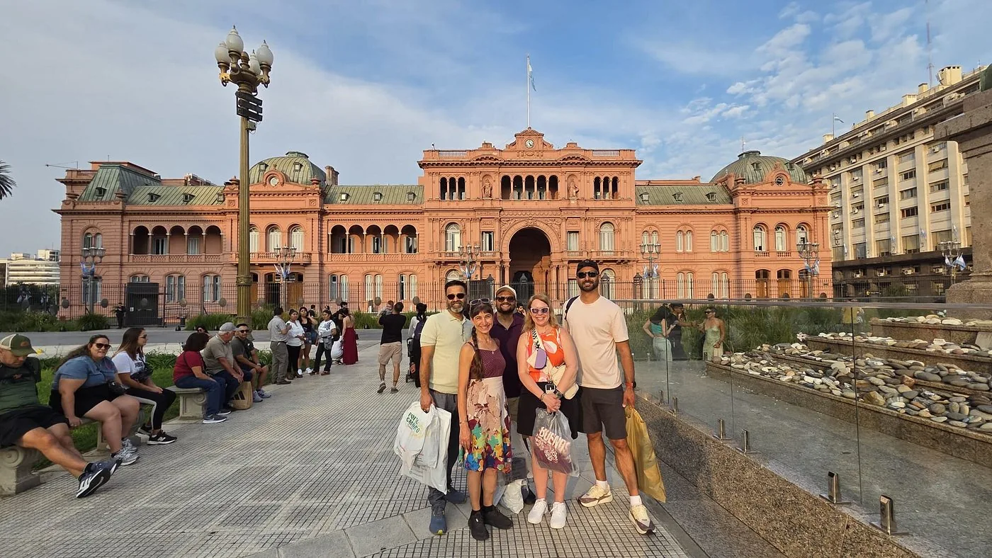 BuenosTours guests with their guide in front of the Casa Rosada in Plaza de Mayo