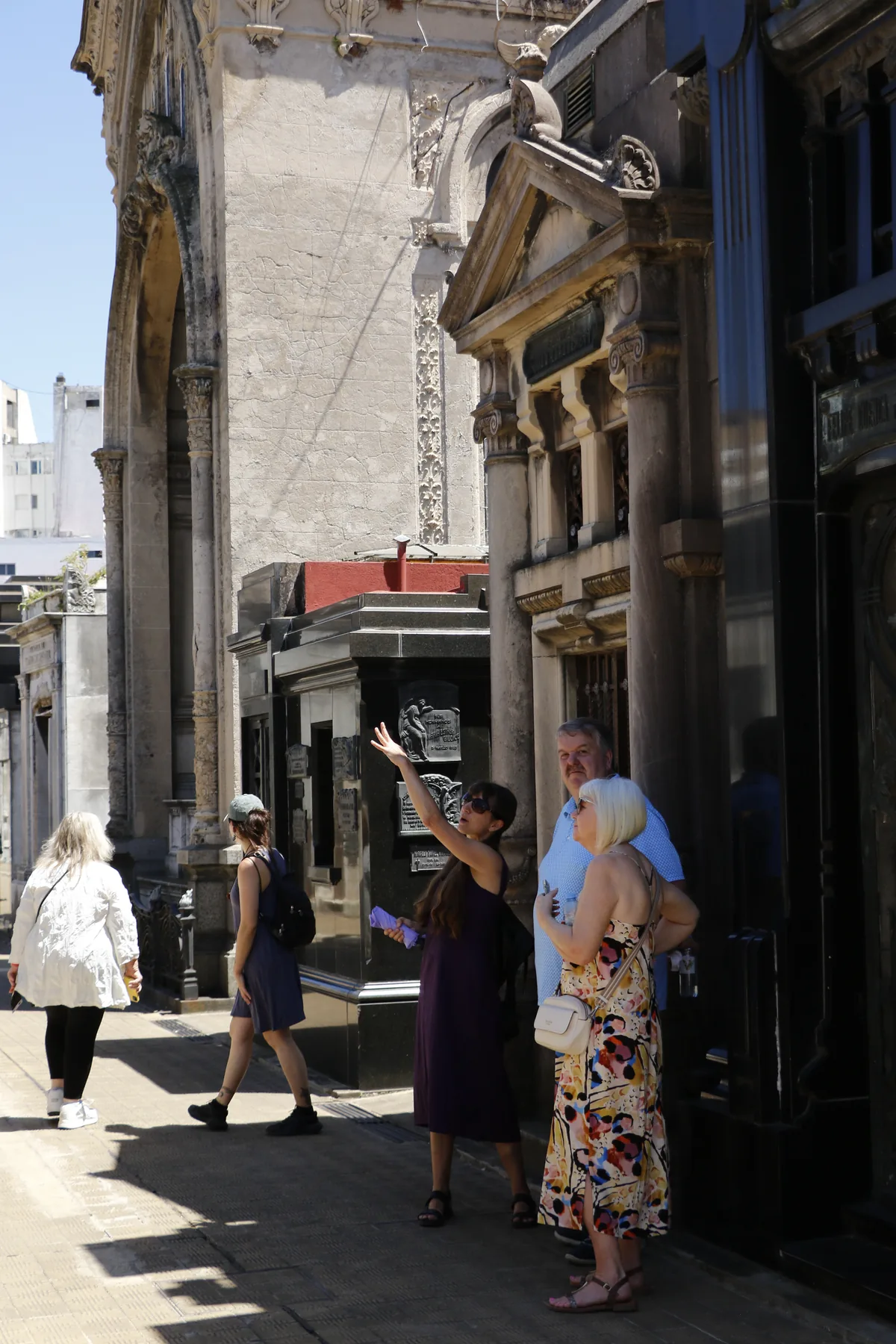 BuenosTours guide Tracy explaining Recoleta Cemetery to a small group